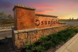 Sunfield neighborhood in Buda TX real estate community with modern homes and amenities
